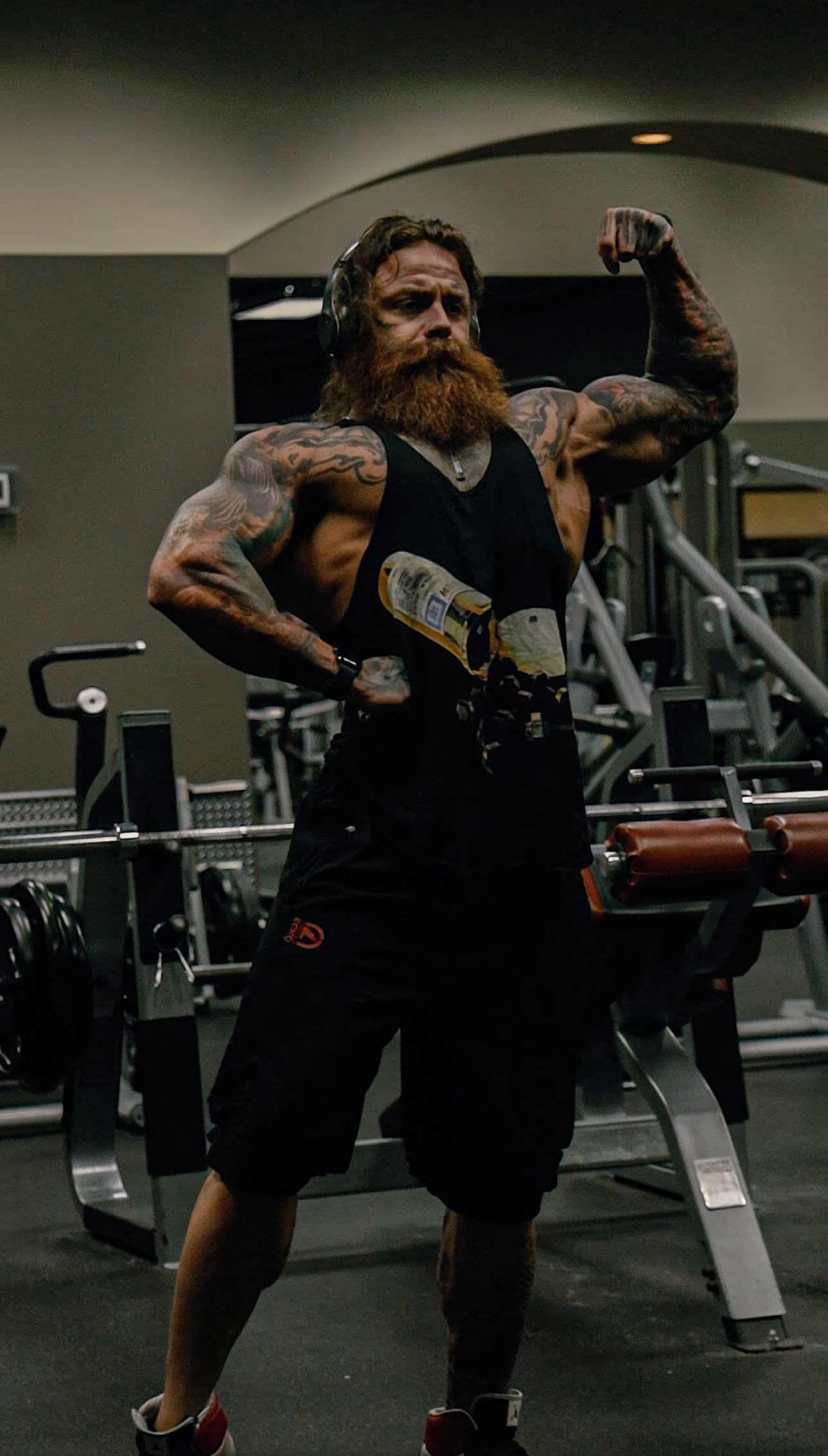 Kevin in the gym flexing