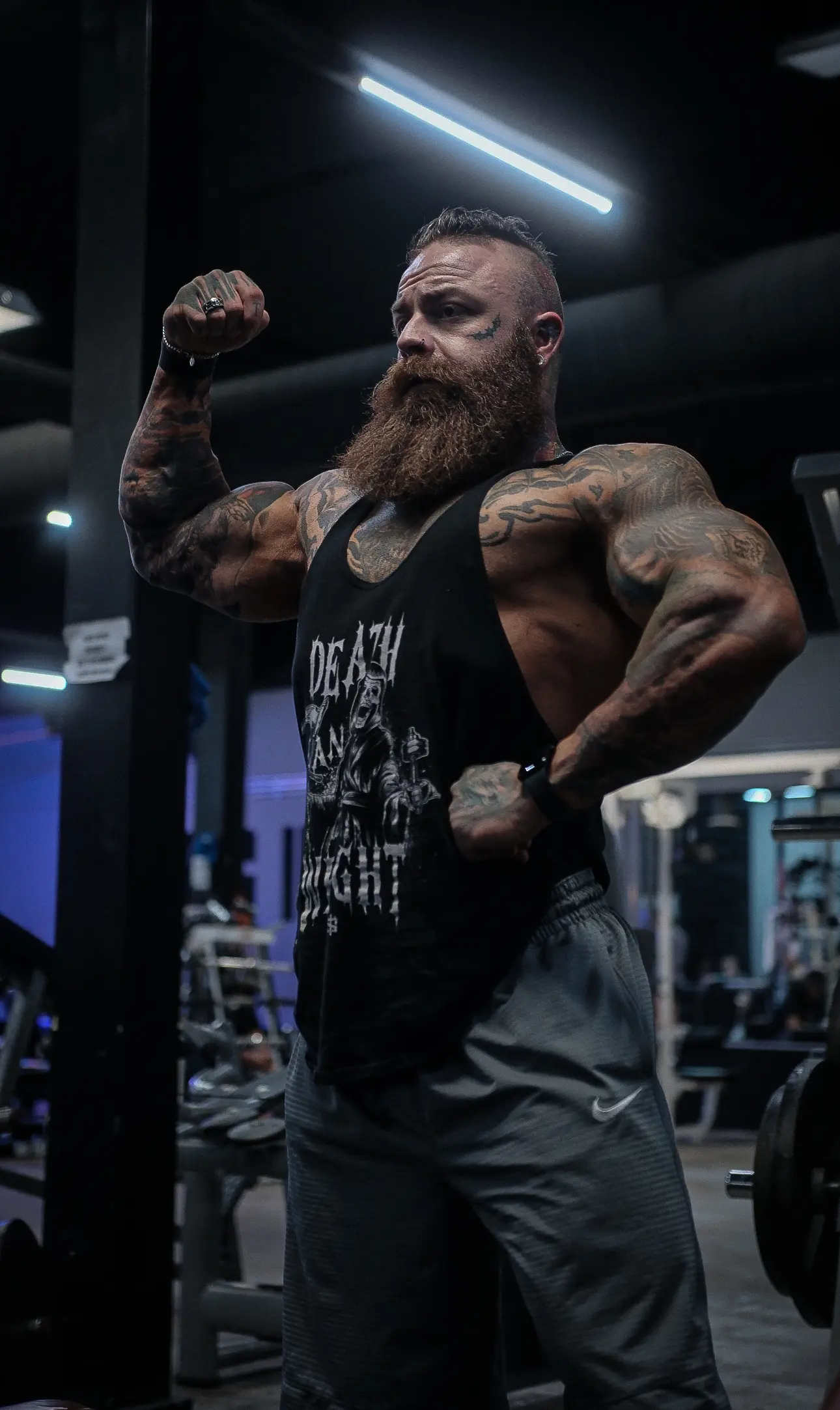 Kevin flexing his arms.