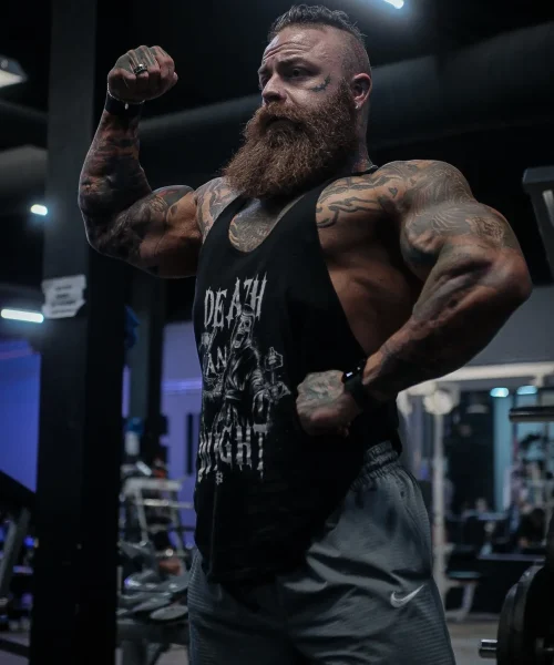 Kevin flexing his arms.